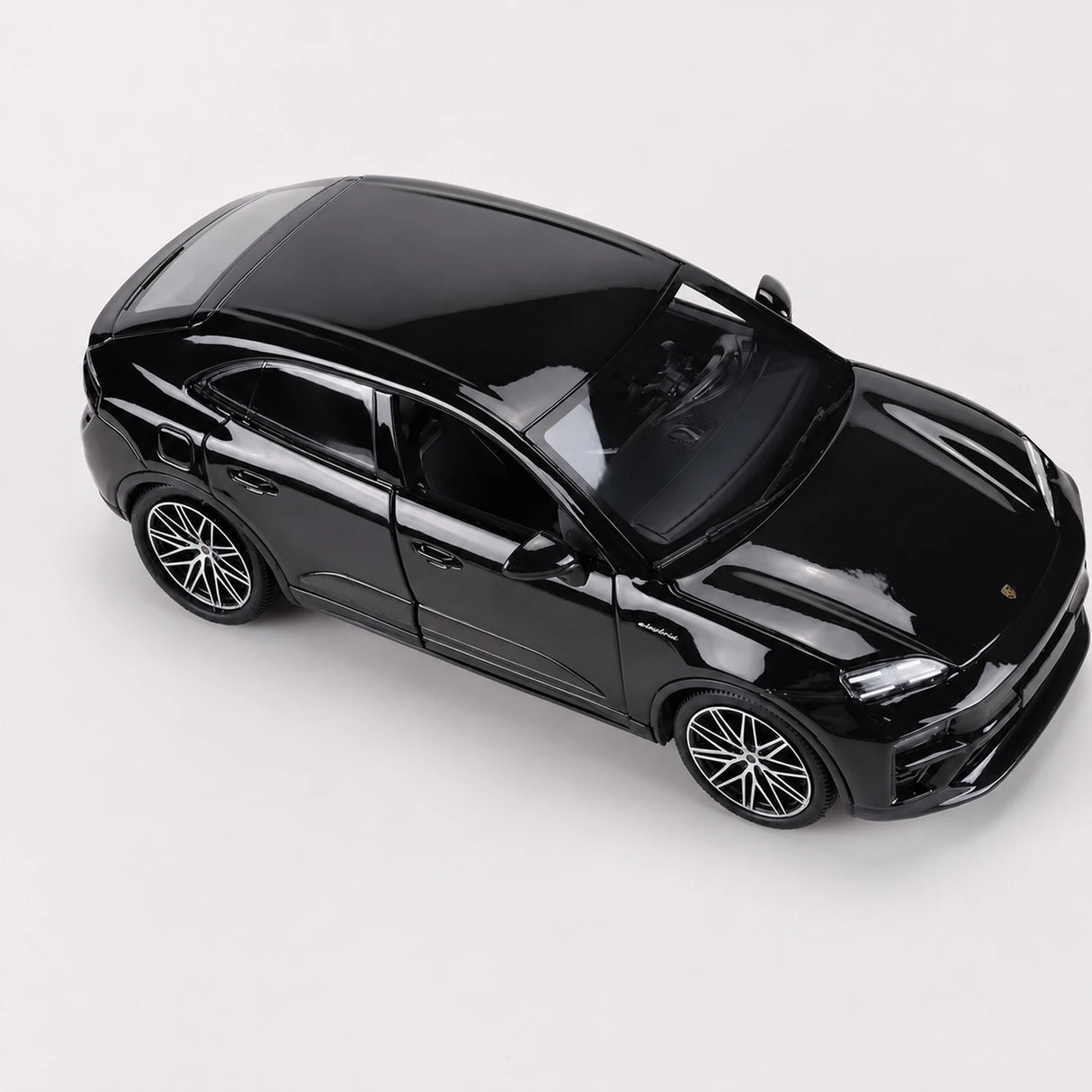 Bburago Porsche 2024 Macan Turbo Black 1:24 – model wyświetlacza odlewany