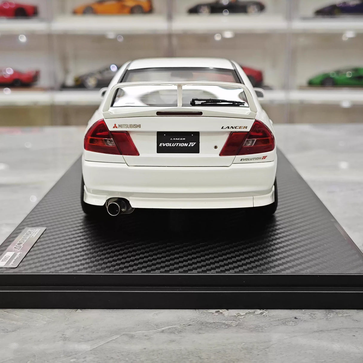 Ignição Mitsubishi 1997 Lancer Evo IV White 1:18 – Modelo de Resina de Coleção
