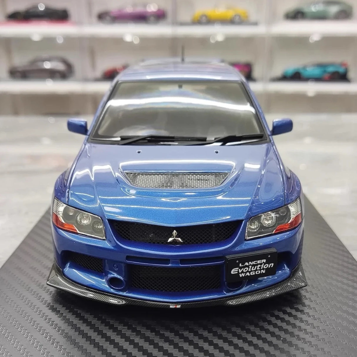 إغنيشن Mitsubishi 2005 لانسر إيفو IX واجون بلو 1:18 – راتنج نموذجي قابل للجمع