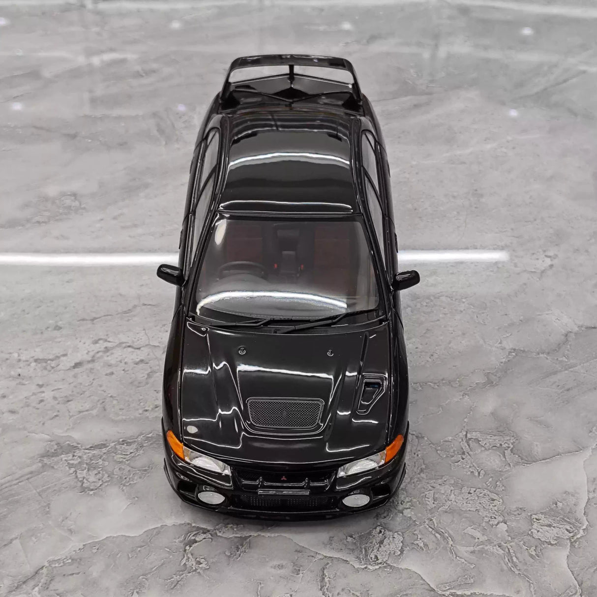 MotorHelix Mitsubishi 1997 Lancer Evolution IV Black 1:18 – Kolekcjonerski model odlewany z metalu