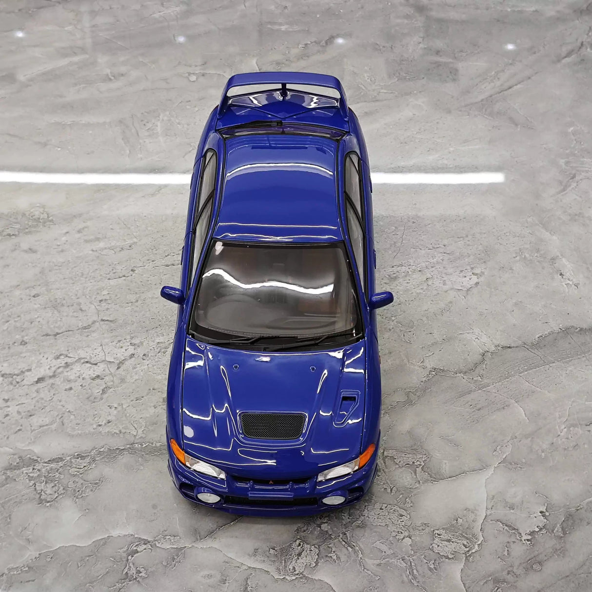 MotorHelix Mitsubishi 1997 Lancer Evolution IV Blue 1:18 – Kolekcjonerski model odlewany z odlewu