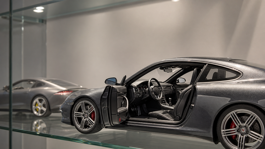 Editorial cover: judging interior detail on premium 1:18 collector model cars (sealed resin vs opening diecast)