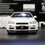 AutoArt Nissan 2000 Skyline GT-R R34 V-Spec II White 1:18 – نموذج معدني قابل للجمع مصبوب.