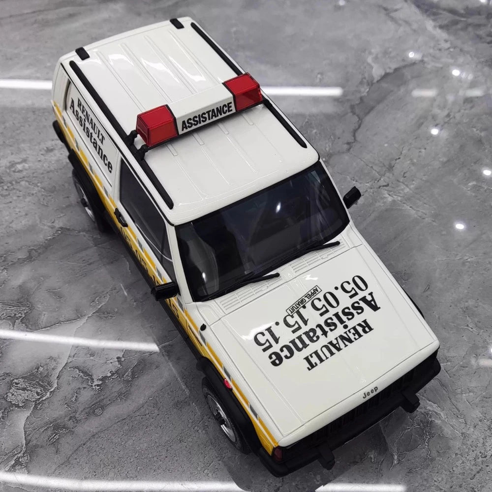 [OTTO] 1:18 Jeep 1990 Cherokee Renault Assistance modellbil harts