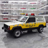 [OTTO] 1:18 Jeep 1990 Cherokee Renault Assistance modellbil harts